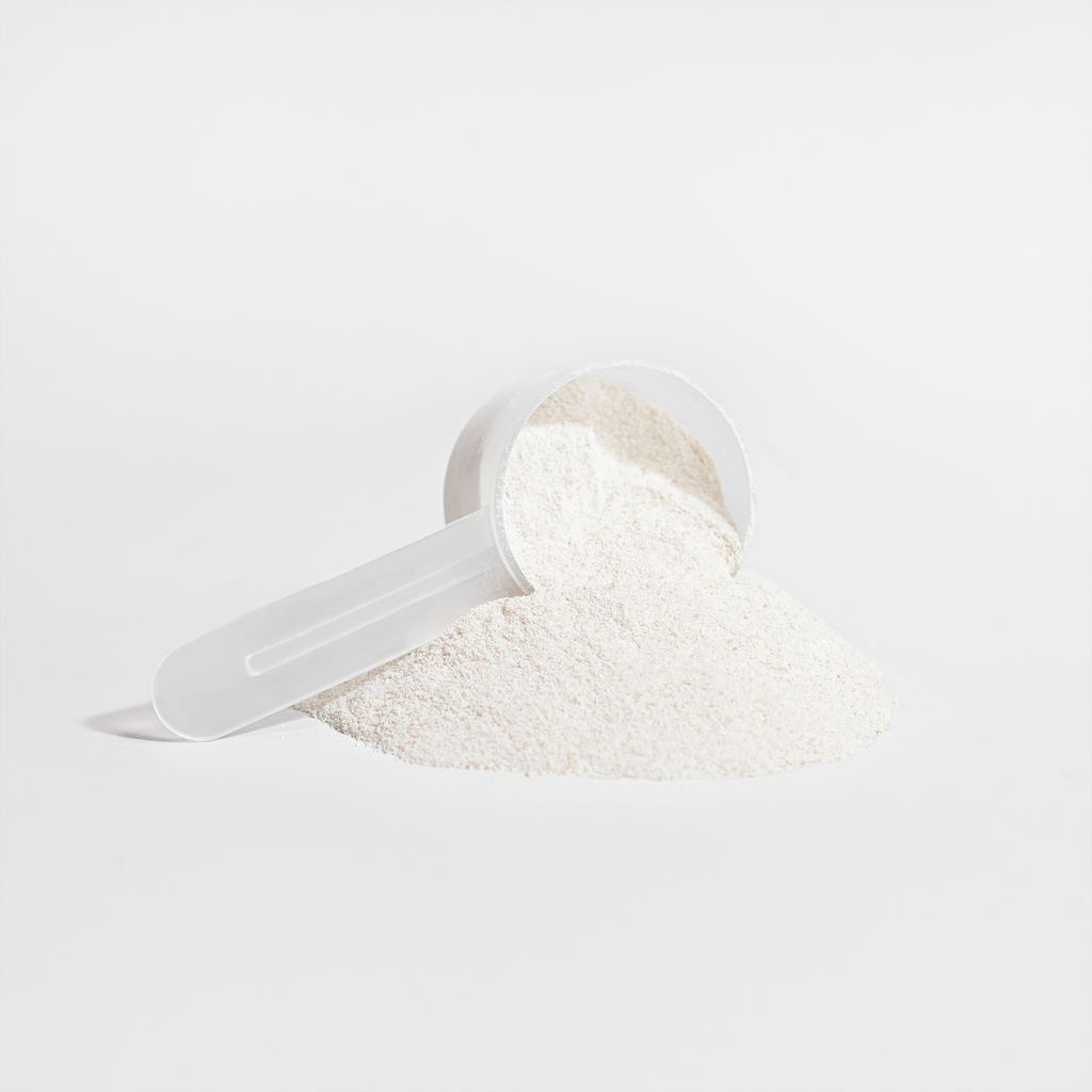 nanonourish™ collagen peptides powder in a scoop